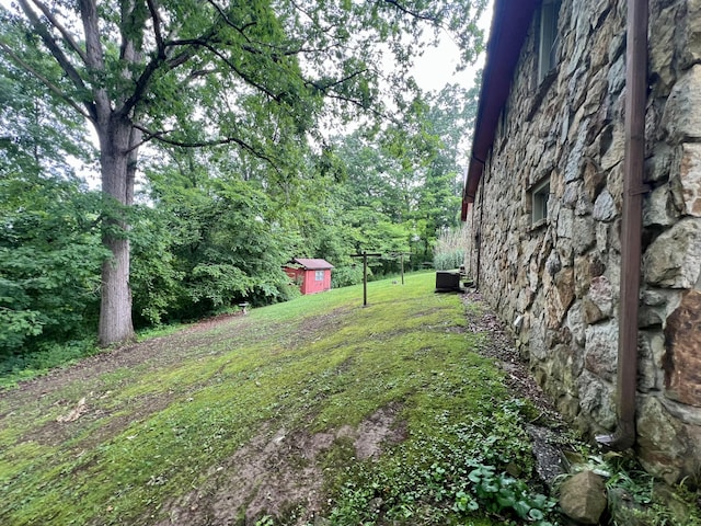 2369 Big Cave Rd, Mount Vernon, KY 40456 - view of grassy yard featuring an outbuilding