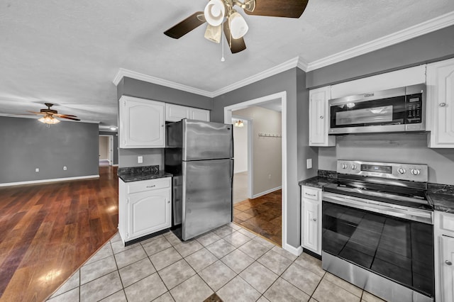 399 Stonecrest Rd, Winchester, KY 40391 - kitchen featuring appliances with stainless steel finishes, ceiling fan, white cabinetry, ornamental molding, and a textured ceiling