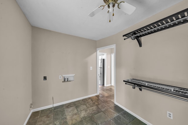 399 Stonecrest Rd, Winchester, KY 40391 - empty room with baseboards, dark stone finish floors, and a ceiling fan