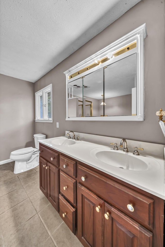 399 Stonecrest Rd, Winchester, KY 40391 - full bath with double vanity, toilet, tile patterned flooring, and a textured ceiling