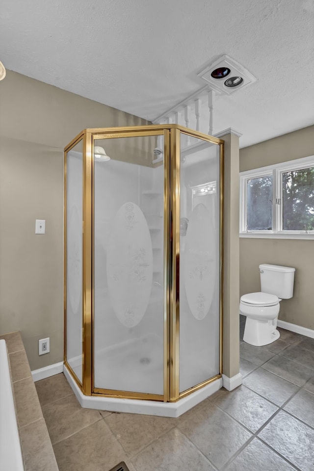 399 Stonecrest Rd, Winchester, KY 40391 - full bathroom with a textured ceiling, toilet, a shower stall, tile patterned floors, and baseboards