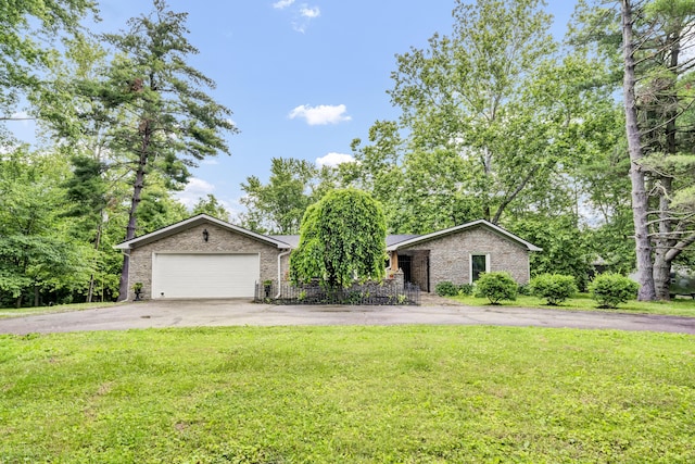 399 Stonecrest Rd, Winchester, KY 40391 - view of front of home featuring asphalt driveway, a front lawn, a garage, and brick siding