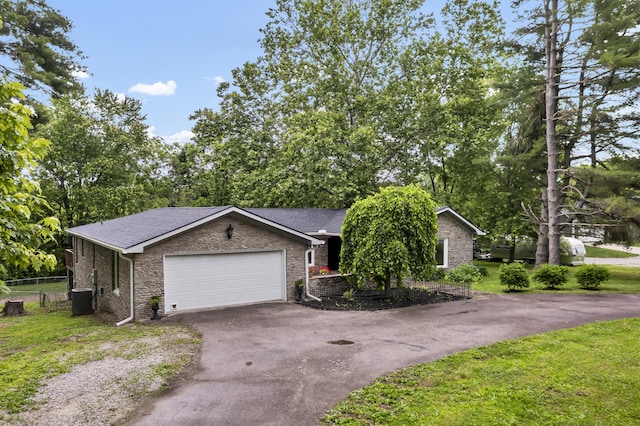 399 Stonecrest Rd, Winchester, KY 40391 - view of front of home with driveway, a garage, cooling unit, and brick siding