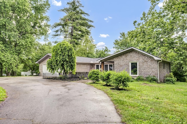 399 Stonecrest Rd, Winchester, KY 40391 - view of front of house with stone siding, a front yard, and brick siding