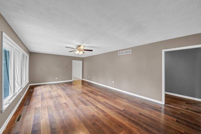 399 Stonecrest Rd, Winchester, KY 40391 - unfurnished room with a ceiling fan, dark wood finished floors, baseboards, and a textured ceiling