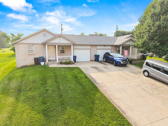 4019 Jodis Way, Somerset, KY 42503 - single story home featuring brick siding, driveway, a porch, and an attached garage