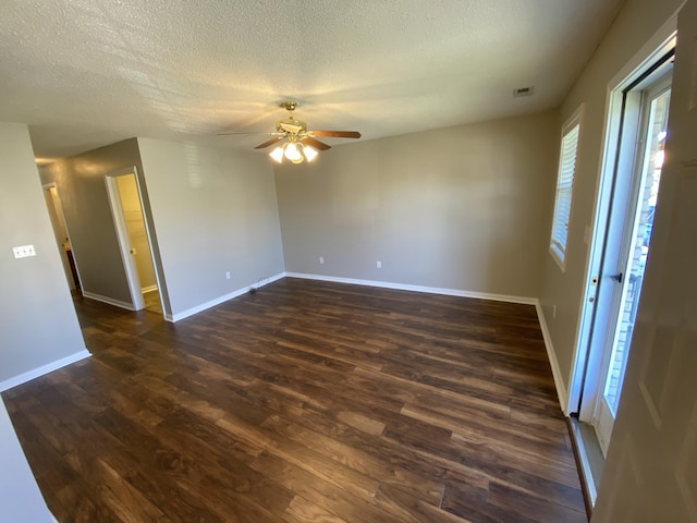 4019 Jodis Way, Somerset, KY 42503 - empty room with dark wood-style floors, healthy amount of natural light, a textured ceiling, a ceiling fan, and baseboards