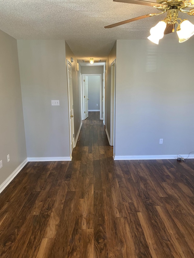 4019 Jodis Way, Somerset, KY 42503 - spare room featuring dark wood finished floors, ceiling fan, baseboards, and a textured ceiling
