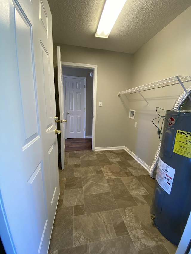 4019 Jodis Way, Somerset, KY 42503 - laundry area featuring water heater, washer hookup, a textured ceiling, and baseboards