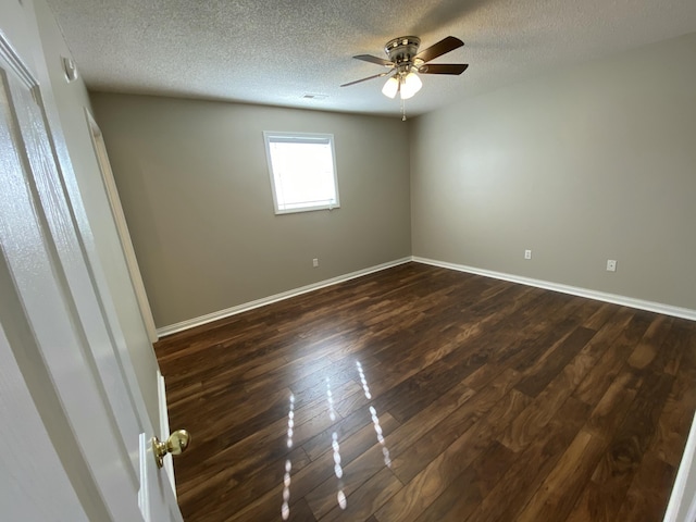 4019 Jodis Way, Somerset, KY 42503 - spare room featuring ceiling fan, dark wood-style floors, a textured ceiling, and baseboards