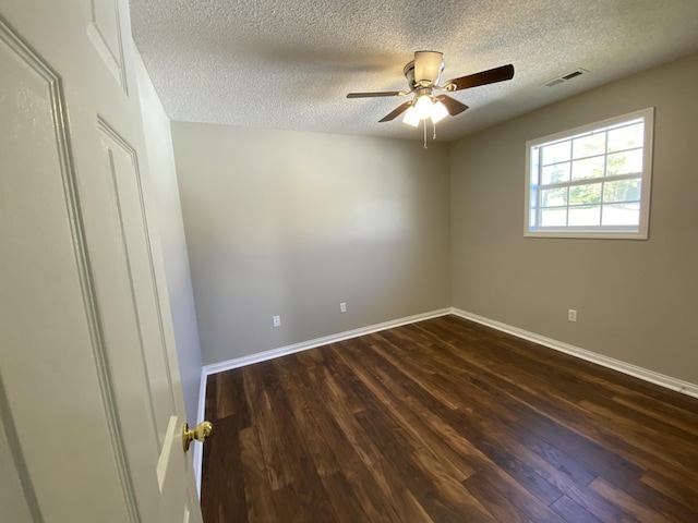 4019 Jodis Way, Somerset, KY 42503 - spare room with a textured ceiling, dark wood-type flooring, a ceiling fan, and baseboards