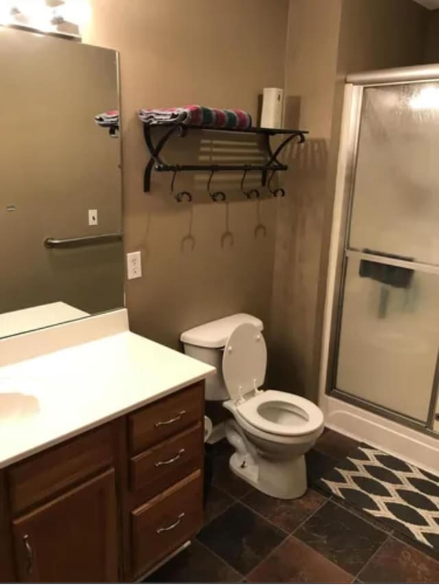 4019 Jodis Way, Somerset, KY 42503 - bathroom with vanity, toilet, and a stall shower