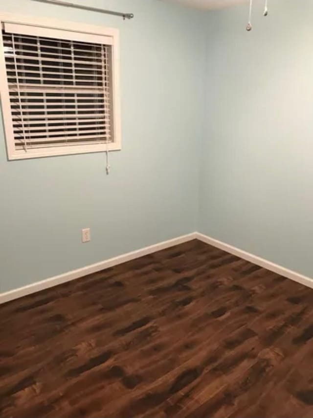 4019 Jodis Way, Somerset, KY 42503 - spare room featuring baseboards and dark wood finished floors