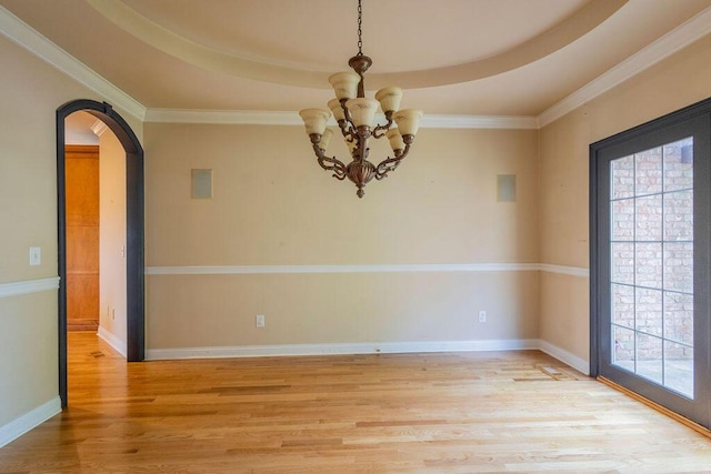 2433 San Milano Pl, Lexington, KY 40509 - spare room with arched walkways, light wood-type flooring, a chandelier, ornamental molding, and baseboards