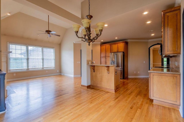 2433 San Milano Pl, Lexington, KY 40509 - kitchen featuring vaulted ceiling, a ceiling fan, brown cabinets, a chandelier, and high end fridge