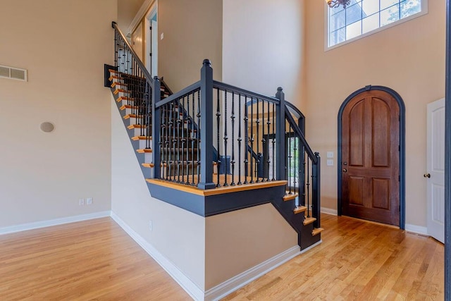 2433 San Milano Pl, Lexington, KY 40509 - foyer with a towering ceiling, wood finished floors, baseboards, and stairway