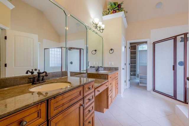 2433 San Milano Pl, Lexington, KY 40509 - full bathroom with a shower stall, vanity, lofted ceiling, tile patterned floors, and a walk in closet