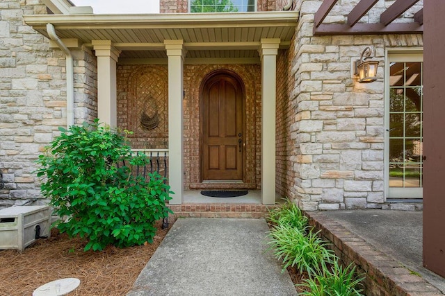 2433 San Milano Pl, Lexington, KY 40509 - view of exterior entry featuring stone siding and covered porch