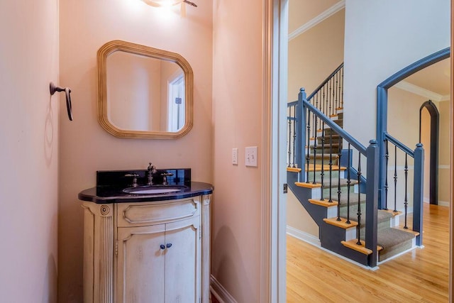 2433 San Milano Pl, Lexington, KY 40509 - bathroom featuring ornamental molding, wood finished floors, vanity, and baseboards