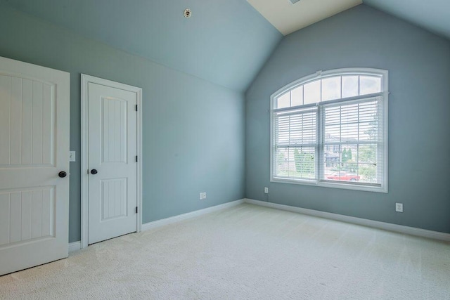 2433 San Milano Pl, Lexington, KY 40509 - unfurnished bedroom featuring vaulted ceiling, carpet, and baseboards