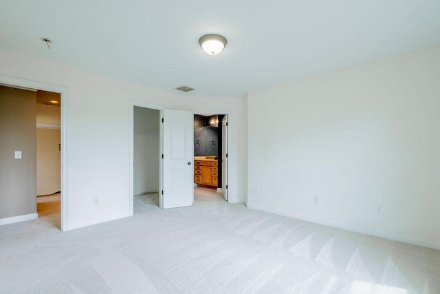 2433 San Milano Pl, Lexington, KY 40509 - unfurnished bedroom with light carpet, baseboards, a closet, and connected bathroom
