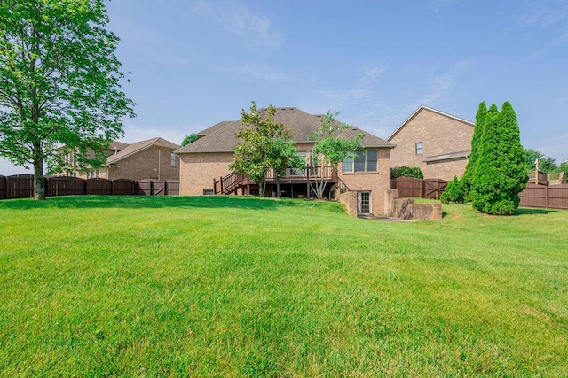 2433 San Milano Pl, Lexington, KY 40509 - rear view of house with stairway, brick siding, and a wooden deck