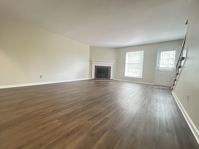 3154 High Ridge Dr, Lexington, KY 40517 - unfurnished living room featuring dark wood-style floors, a fireplace, baseboards, and stairway