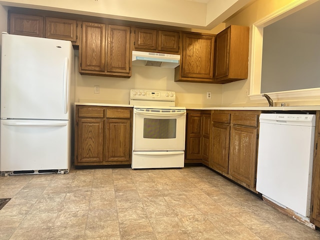 3154 High Ridge Dr, Lexington, KY 40517 - kitchen featuring white appliances, under cabinet range hood, brown cabinetry, light countertops, and a sink