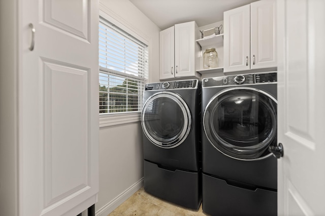 398 Arden Dr, London, KY 40741 - laundry room with washer and clothes dryer, baseboards, cabinet space, and light tile patterned floors