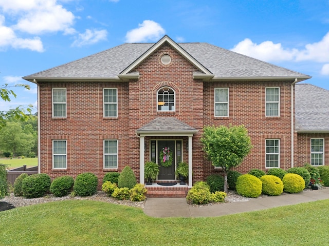 398 Arden Dr, London, KY 40741 - colonial inspired home featuring brick siding, a front lawn, and roof with shingles