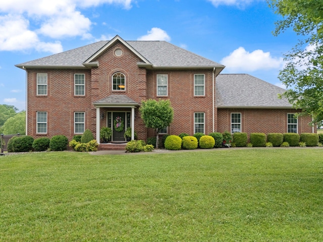 398 Arden Dr, London, KY 40741 - view of front of home featuring a front yard, brick siding, and roof with shingles