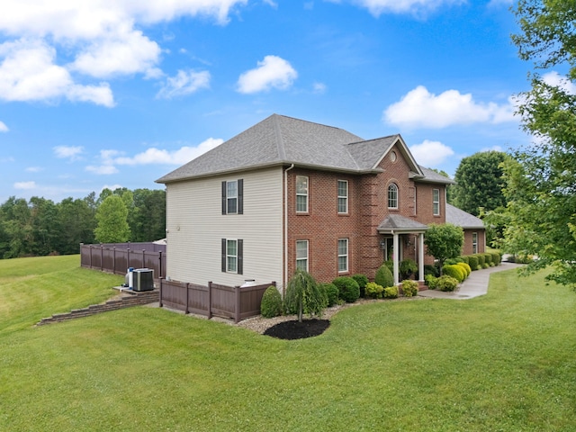 398 Arden Dr, London, KY 40741 - view of property exterior with a yard, central air condition unit, brick siding, and roof with shingles