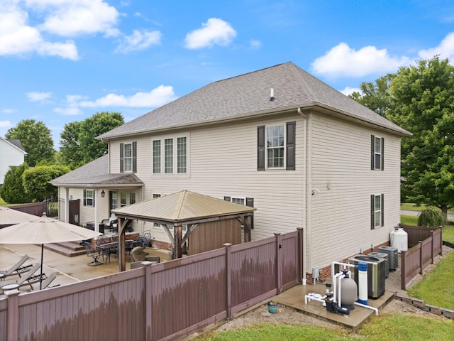 398 Arden Dr, London, KY 40741 - rear view of property featuring a gazebo, a patio area, a shingled roof, and central AC
