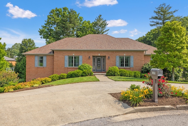 105 Wellington Cv, Danville, KY 40422 - bungalow-style house featuring brick siding, roof with shingles, and concrete driveway