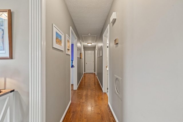 105 Wellington Cv, Danville, KY 40422 - hall with attic access, wood finished floors, baseboards, and a textured ceiling