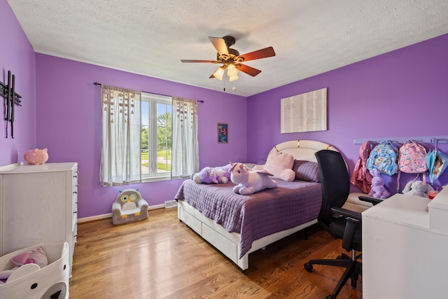 105 Wellington Cv, Danville, KY 40422 - bedroom featuring wood finished floors, baseboards, ceiling fan, a textured ceiling, and an office area