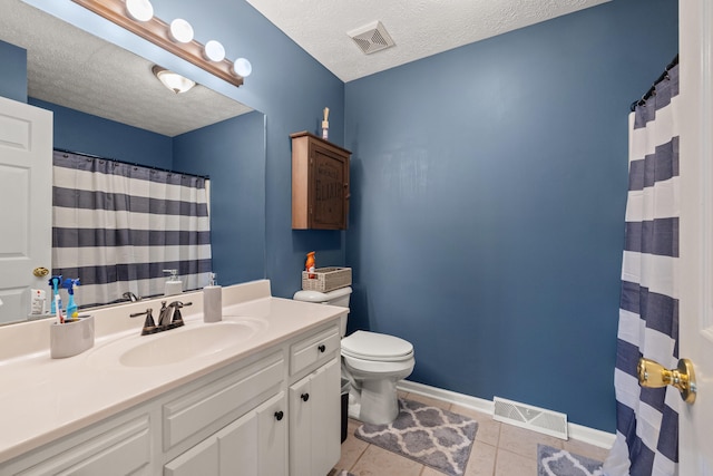 105 Wellington Cv, Danville, KY 40422 - full bath featuring toilet, vanity, tile patterned floors, a textured ceiling, and baseboards