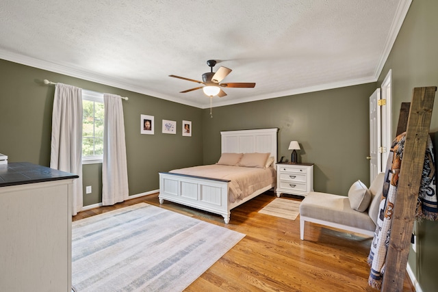 105 Wellington Cv, Danville, KY 40422 - bedroom featuring crown molding, wood finished floors, a textured ceiling, ceiling fan, and baseboards
