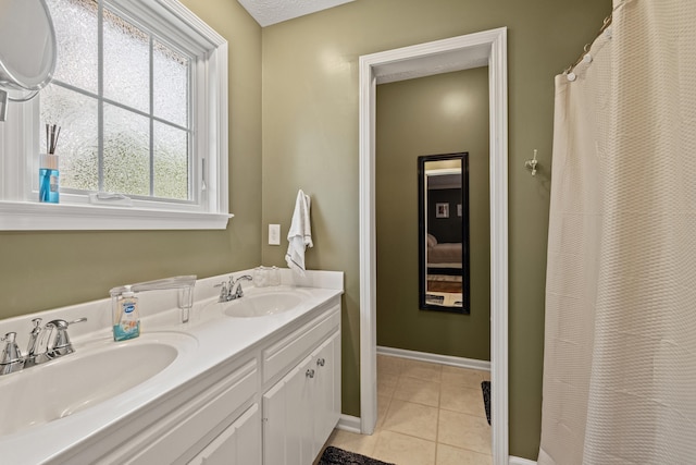 105 Wellington Cv, Danville, KY 40422 - bathroom featuring double vanity, tile patterned flooring, and baseboards