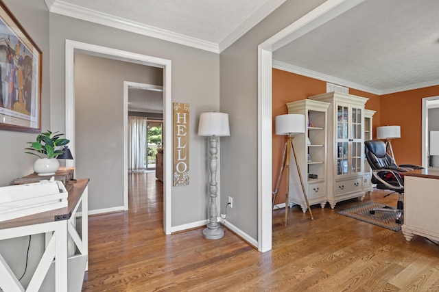 105 Wellington Cv, Danville, KY 40422 - office area featuring wood finished floors, baseboards, ornamental molding, and a textured ceiling