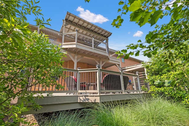 105 Wellington Cv, Danville, KY 40422 - back of property featuring a balcony, brick siding, and a wooden deck