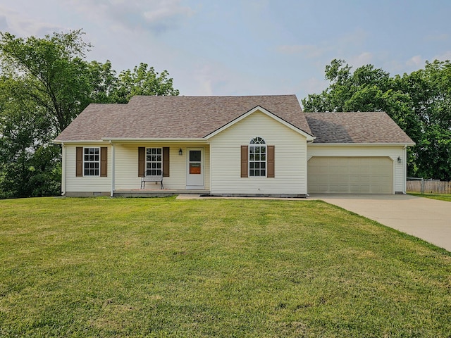 186 Amber Ln, Hustonville, KY 40437 - ranch-style home featuring driveway, an attached garage, a front yard, a porch, and a shingled roof