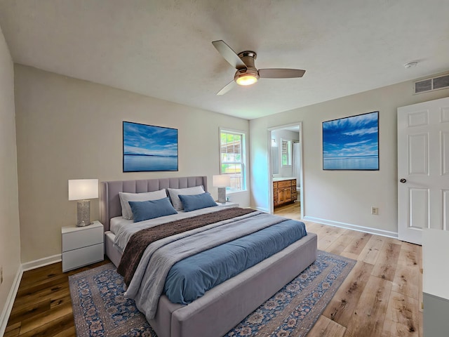 186 Amber Ln, Hustonville, KY 40437 - bedroom featuring light wood-type flooring, baseboards, a ceiling fan, and ensuite bath