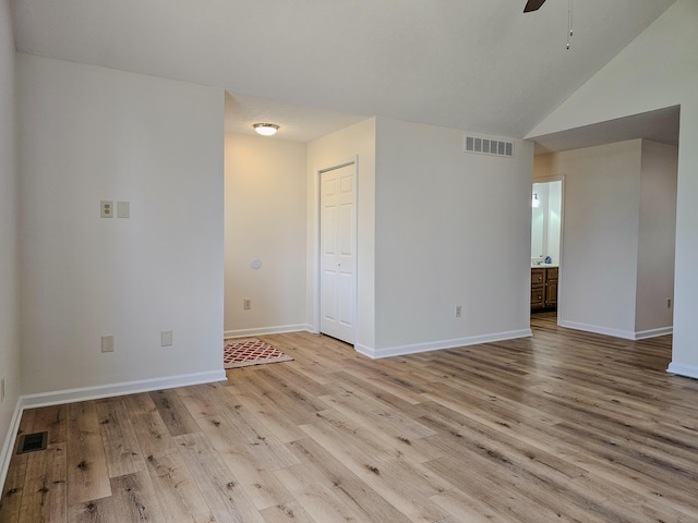 186 Amber Ln, Hustonville, KY 40437 - spare room featuring light wood-type flooring, baseboards, a ceiling fan, and lofted ceiling
