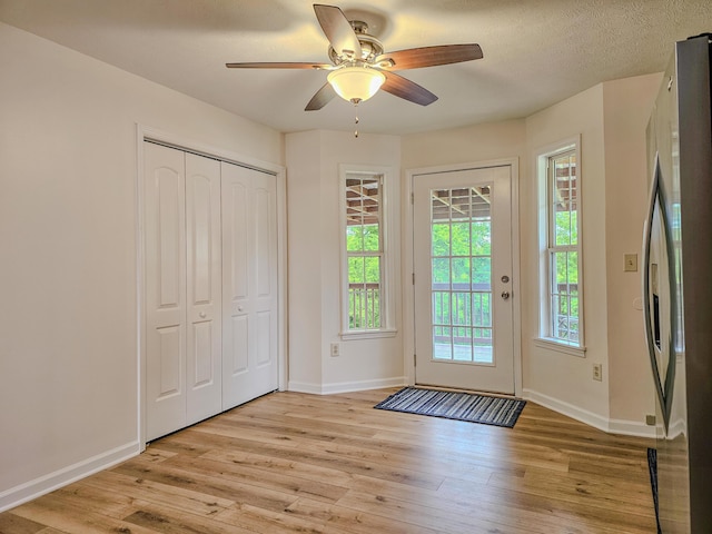 186 Amber Ln, Hustonville, KY 40437 - entryway featuring light wood-type flooring, ceiling fan, and baseboards