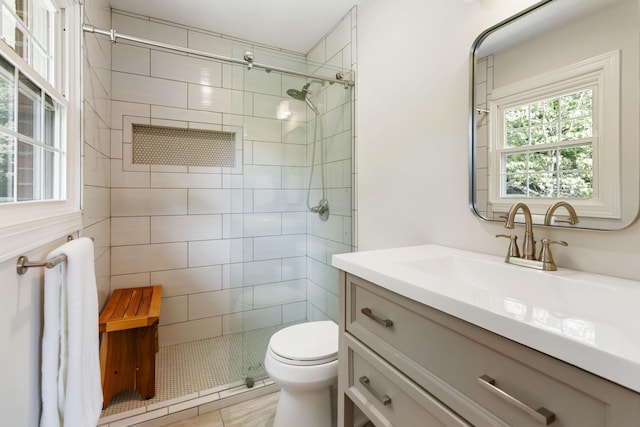 131 Reasor St, Corbin, KY 40701 - full bathroom featuring vanity, a tile shower, toilet, and tile patterned floors