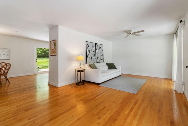 131 Reasor St, Corbin, KY 40701 - living area with ceiling fan, light wood-style flooring, and baseboards