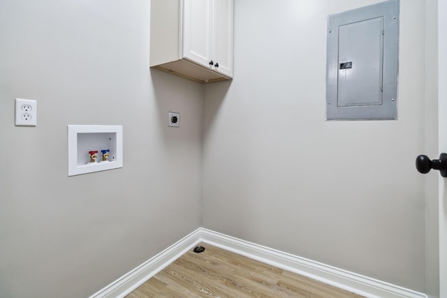 56 Hopewell Church Rd, Corbin, KY 40701 - laundry room with electric panel, cabinet space, electric dryer hookup, light wood-type flooring, and baseboards