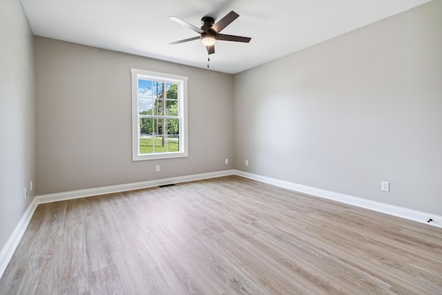 56 Hopewell Church Rd, Corbin, KY 40701 - unfurnished room featuring light wood finished floors, a ceiling fan, and baseboards