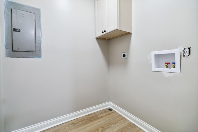 56 Hopewell Church Rd, Corbin, KY 40701 - laundry room featuring electric panel, cabinet space, light wood-style floors, hookup for a washing machine, and hookup for an electric dryer